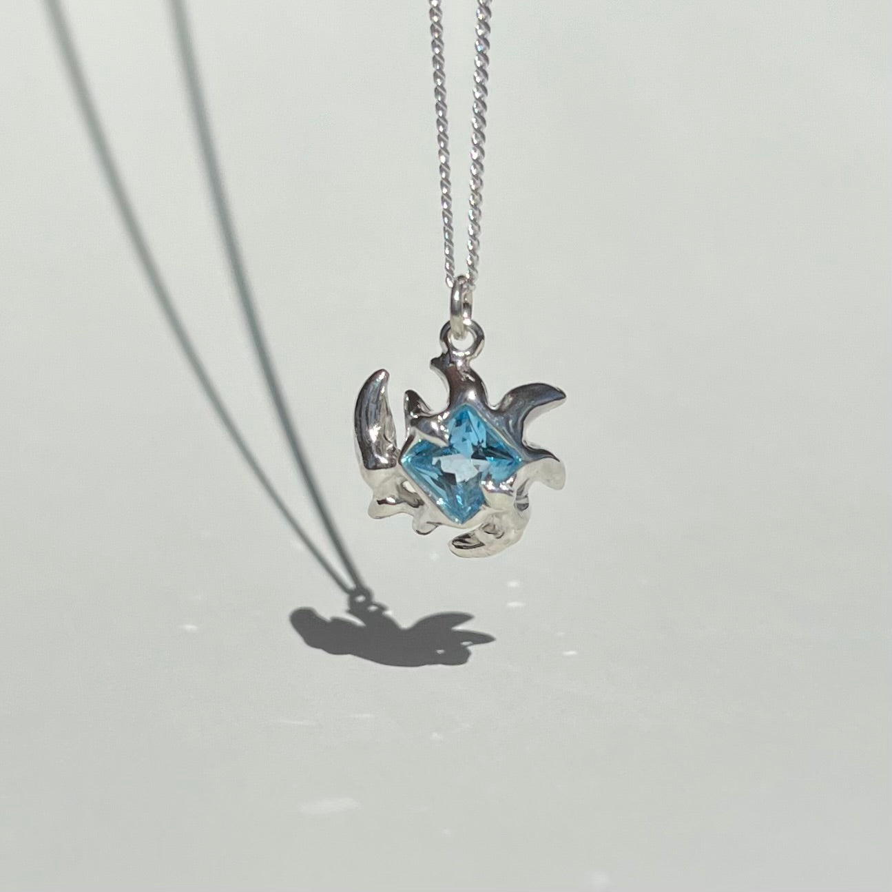 Mini KHAOS sterling silver necklace with square cut Swiss blue topaz gemstone