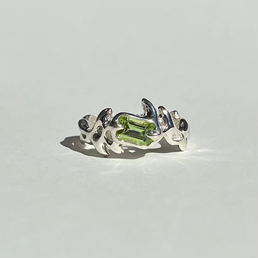 Mini KHAOS sterling silver ring with emerald cut peridot gemstone