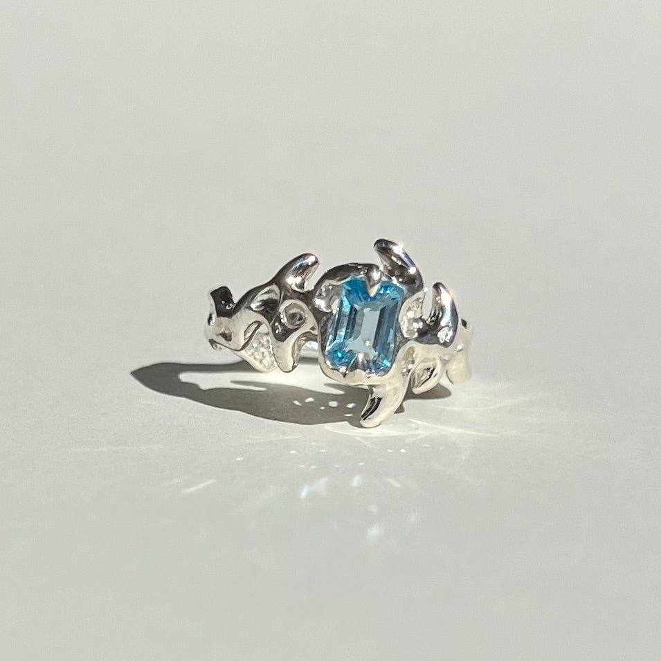 Mini KHAOS sterling silver ring with emerald cut Swiss blue topaz gemstone