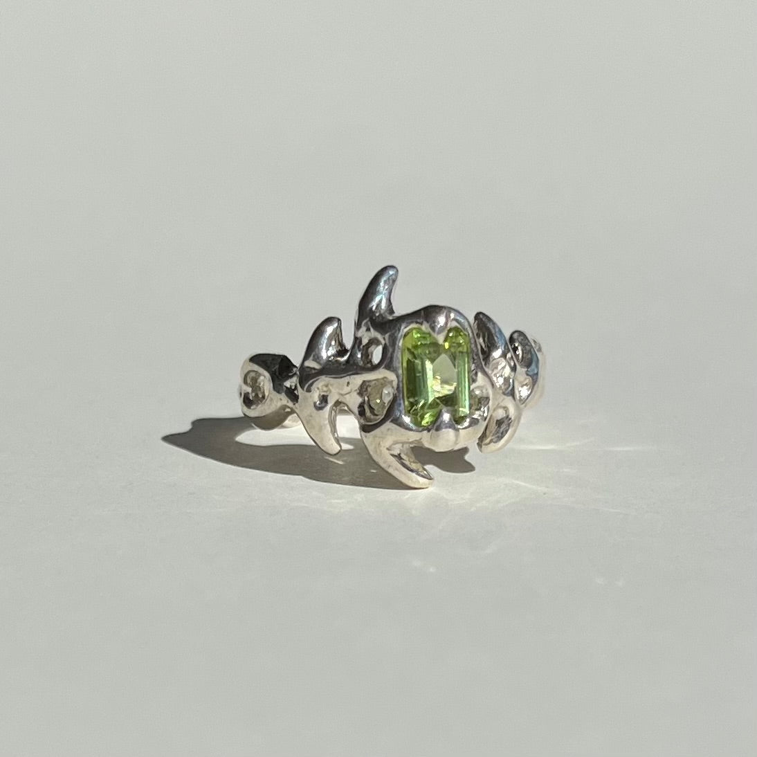 Mini KHAOS sterling silver ring with emerald cut peridot gemstone