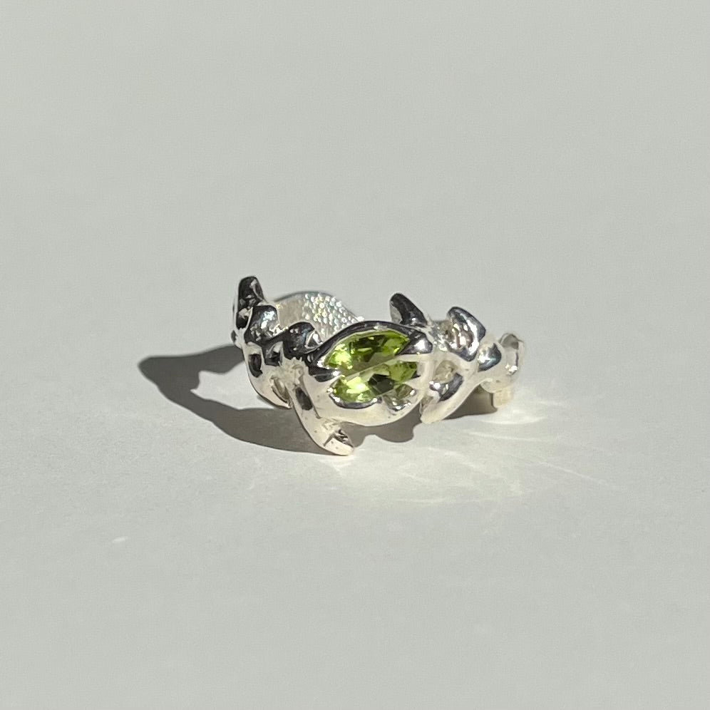 Mini KHAOS sterling silver ring with oval cut peridot gemstone