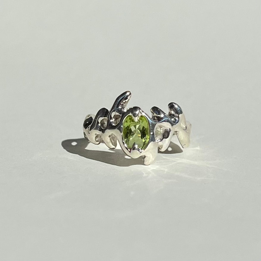 Mini KHAOS sterling silver ring with oval cut peridot gemstone