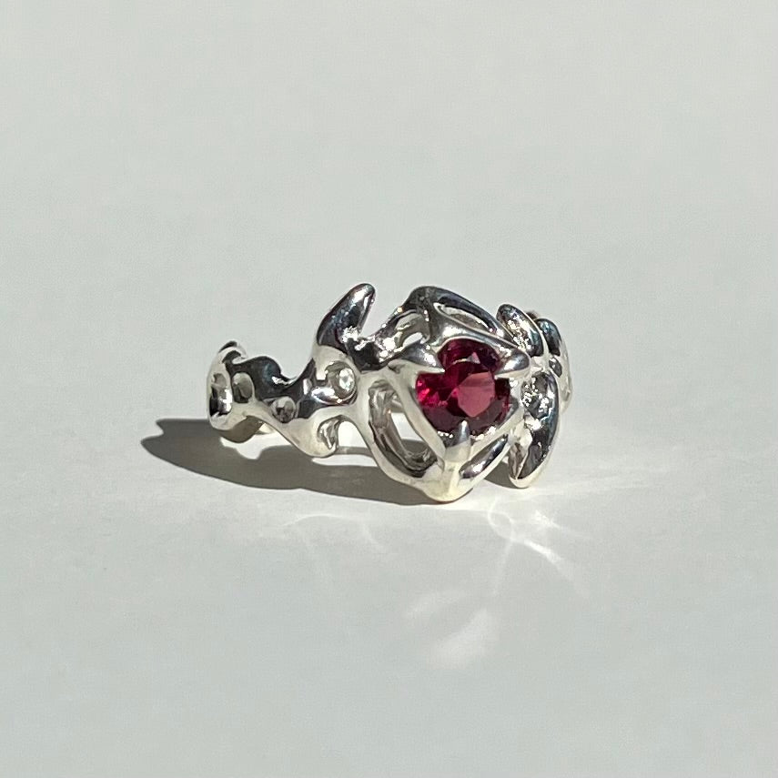 Mini KHAOS sterling silver ring with round cut garnet gemstone